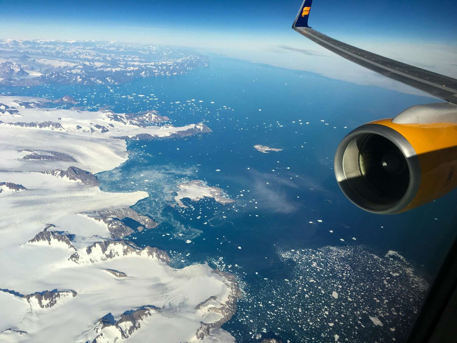 Plane over the Greenland landscape
